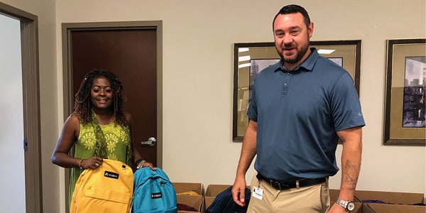 Henry Schein Indianapolis Distribution Center Packs, Donates Items for Students